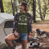 Introducing our exclusive camping t-shirt featuring a camping scene and the catchy slogan "Manitoba - Fires, Friends, Fun."